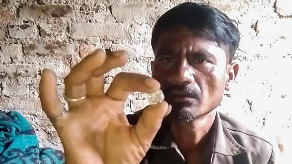 Raju Gold holding the diamond – released to the media.